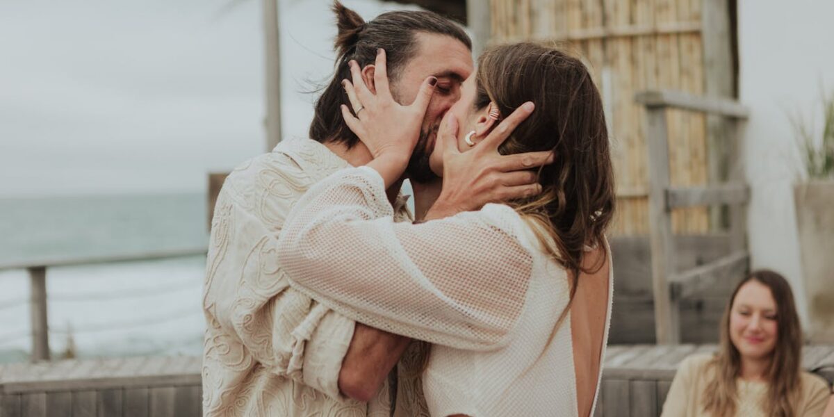 Photo by Carolina Basi: https://www.pexels.com/photo/romantic-beachfront-wedding-kiss-at-sunset-30890464/