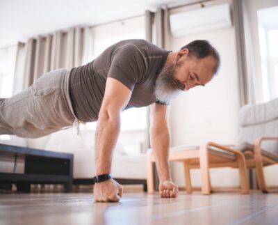 Photo by Mikhail Nilov: https://www.pexels.com/photo/a-man-doing-push-up-on-the-floor-6975784/