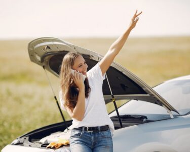 Photo by Gustavo Fring: https://www.pexels.com/photo/positive-woman-using-smartphone-near-broken-automobile-in-countryside-during-car-travel-4173086/