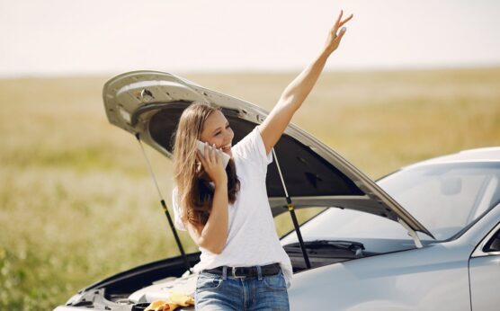Photo by Gustavo Fring: https://www.pexels.com/photo/positive-woman-using-smartphone-near-broken-automobile-in-countryside-during-car-travel-4173086/