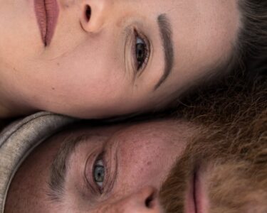 Photo by Katarína Bukerová: https://www.pexels.com/photo/intimate-close-up-of-couple-relaxing-outdoors-32529497/