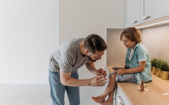 Photo by Pavel Danilyuk: https://www.pexels.com/photo/a-man-in-gray-shirt-looking-at-his-son-s-wounded-knee-8763103/