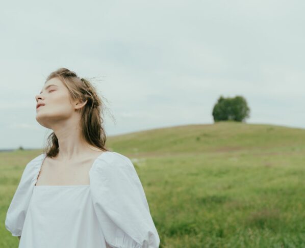 Photo by cottonbro studio: https://www.pexels.com/photo/portrait-of-a-woman-at-the-meadow-5615688/